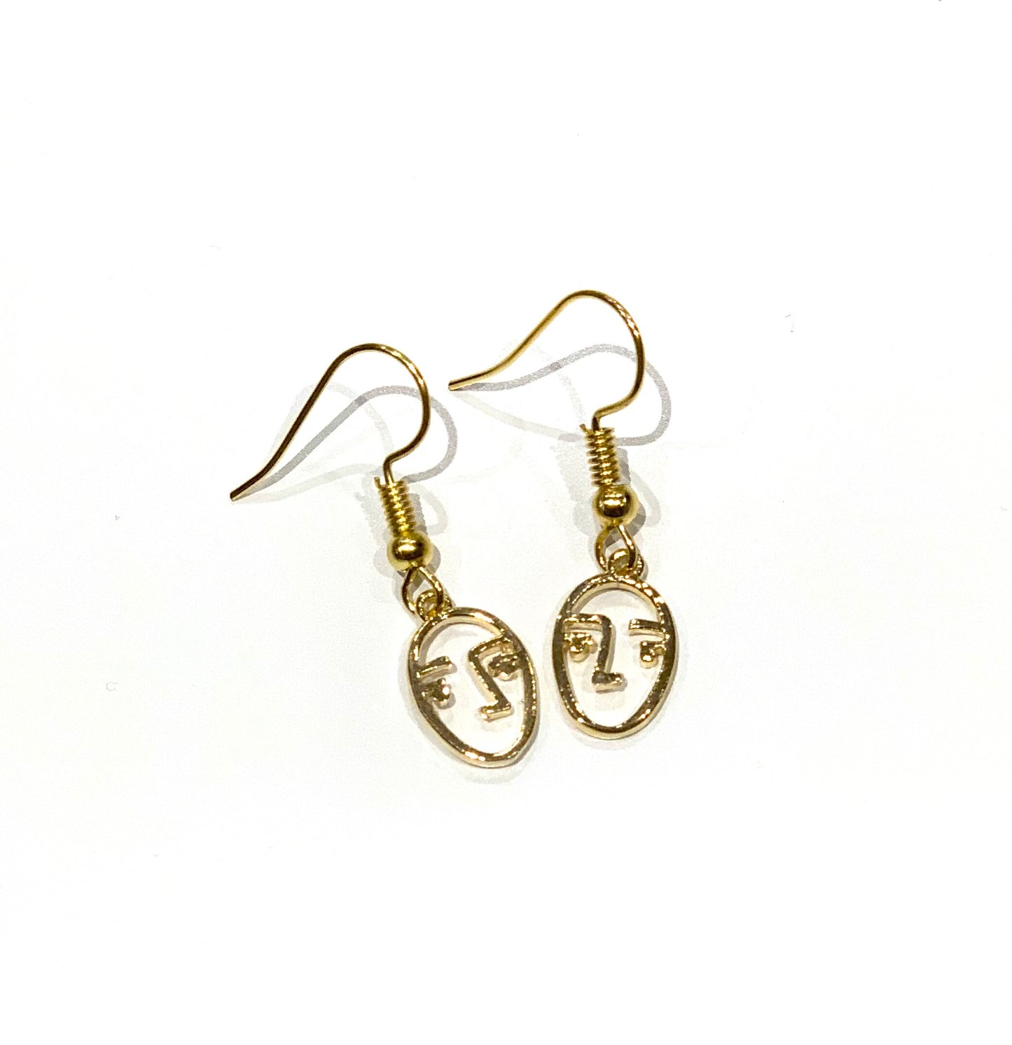 'Face' - gold earrings